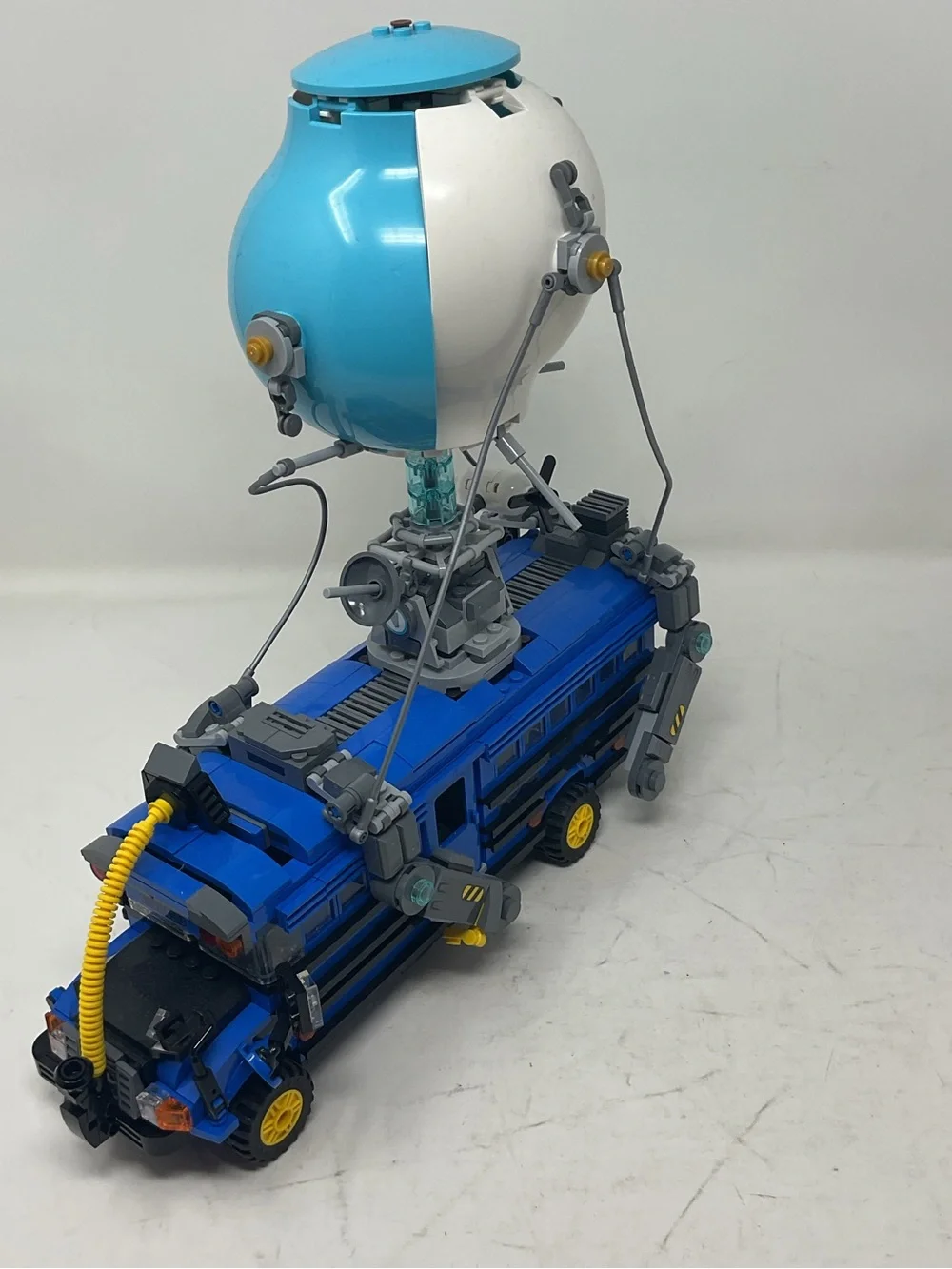 LEGO Blue and White Fortnite Battle Bus with Yellow Accents
